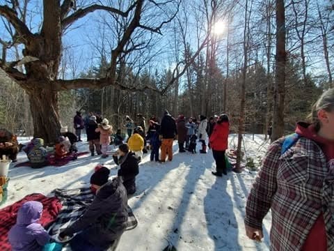 A community gathering out on the land