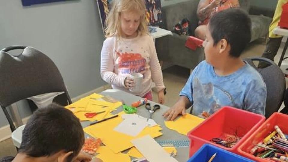 Children making crafts at a youth program